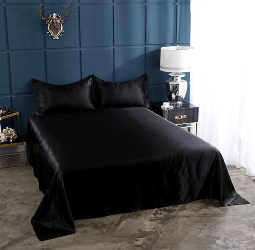 Clarech Ice Silk Bed Sheets in navy on a made bed